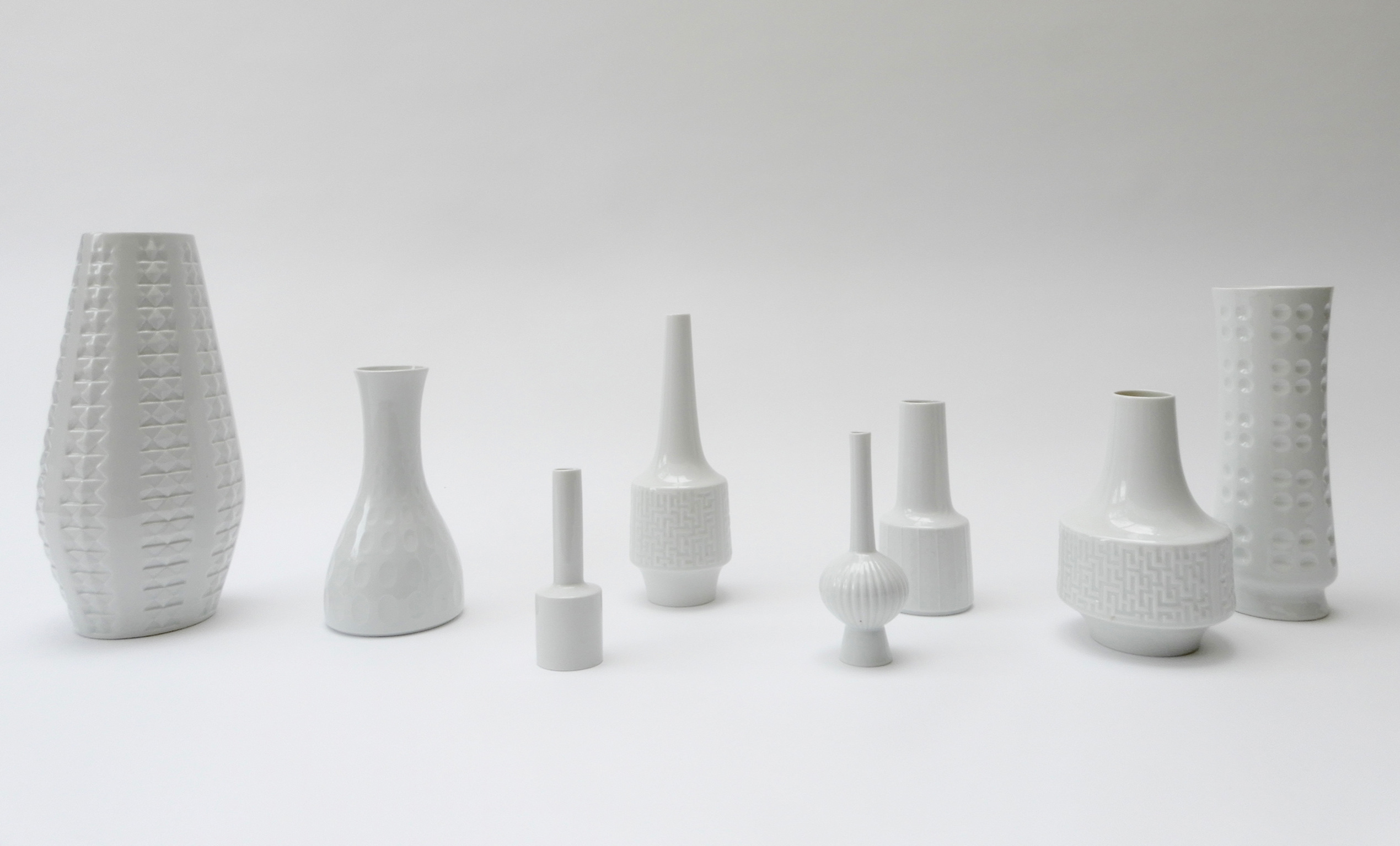 Sold - Set of 8 German White Ceramic Vases