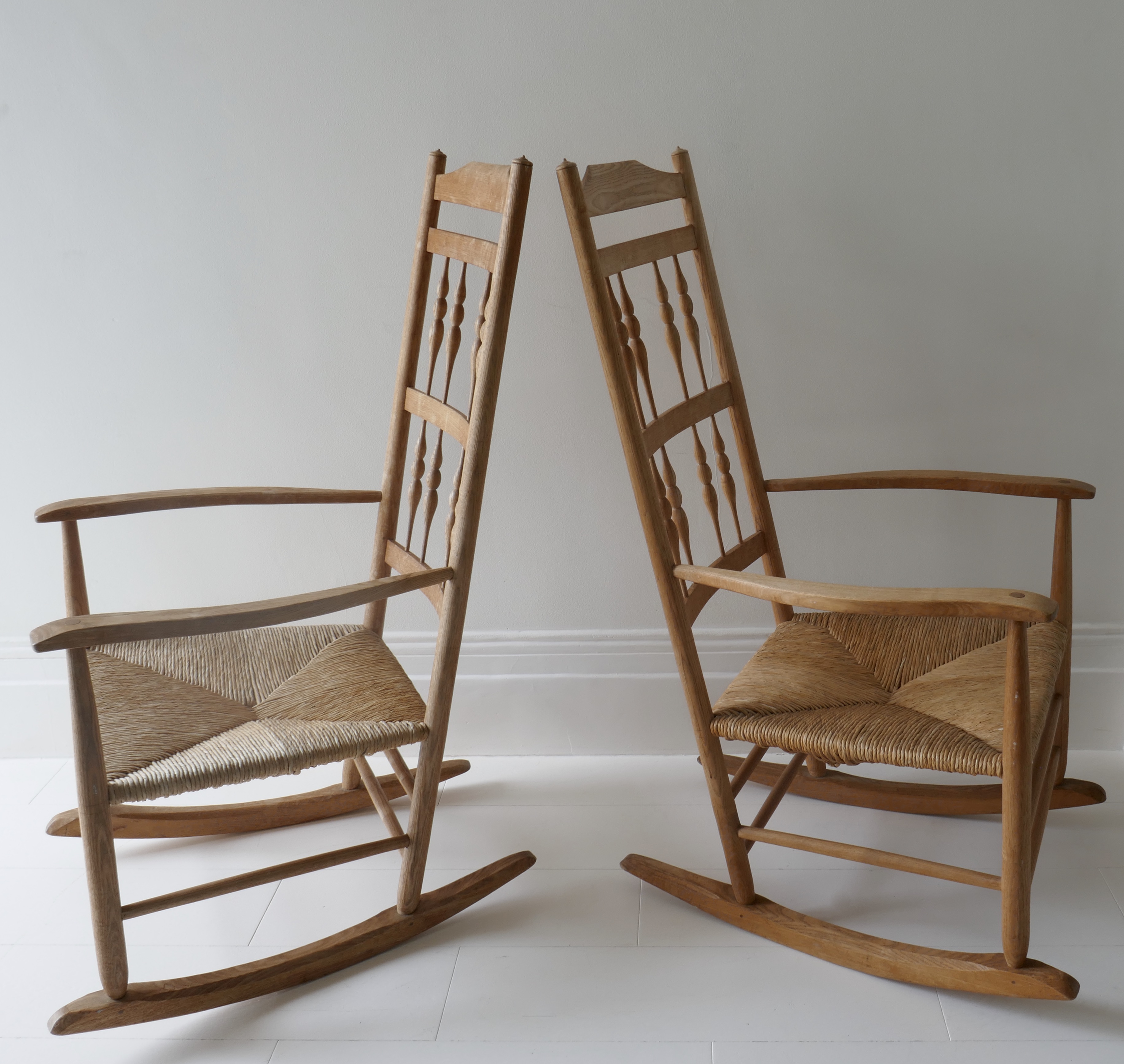 Sold - Pair of Mid-century English wood rocking chairs and straw seats.